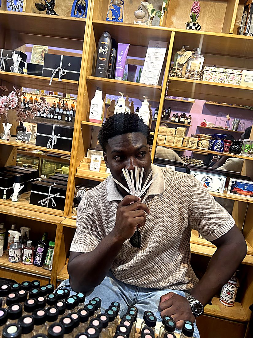 A guest comparing scents on fragrance strips
